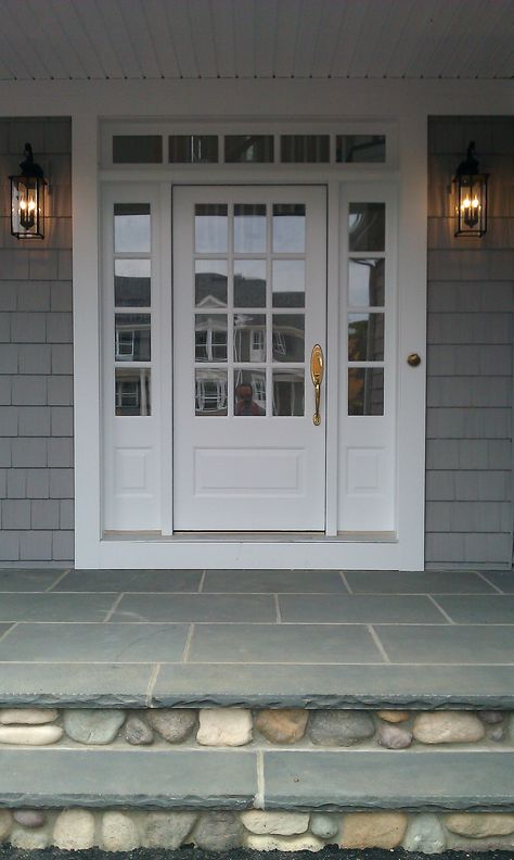 Transome and Sidelites with Wood 3/4 French Front Door painted white. Bluestone and River Rock. Black Carriage Lamps, Gold Hardware and Gold Seashell Doorbell. Now all I need are keys to finally move in! www.NatalieALewis.com Pintu Interior, French Front Doors, White Front Door, Pelan Rumah, Front Door Paint Colors, French Doors Exterior, Stone Steps, Farmhouse Front Door, Door Paint Colors