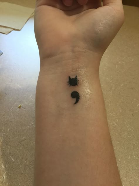 My first tattoo. It's a cat semicolon. Cat Semi Colon Tattoos, Tattoo Meanings Semicolon, Cat Semicolon Tattoo, Cat Semi Colon Tattoo, Tattoo Semicolon, Cat Eye Tattoos, Semicolon Tattoo Meaning, Semicolon Tattoos, Stick Tattoo