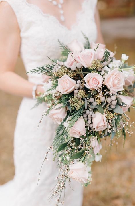 This blush pink rose cascading bridal bouquet with evergreens, genestra, stock and silver brunia berries is the perfect selection for a winter wedding! Light Pink Bridal Bouquet, Bridal Bouquet Roses, Pink Bridal Bouquet, Winter Bridal Bouquets, Small Wedding Bouquets, Blush Bridal Bouquet, Cascading Bridal Bouquets, Cascading Wedding Bouquets, Bouquet Roses