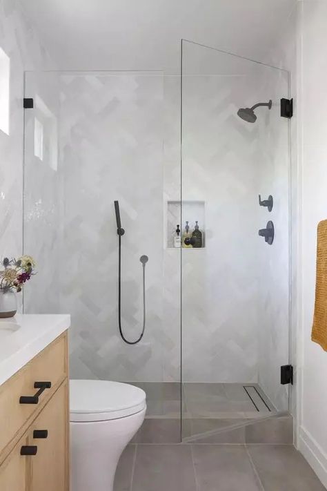 a small bathroom with marble herringbone tiles and grey ones on the floor, a stained vanity and black fixtures Small Bathroom Remodel Walk In Shower Tile Ideas, Cottage Master Bath, Herringbone Tile Bathroom, Small Bathroom Redo, Scandinavian Bathroom Ideas, Secret Basement, Dream Home Bathroom, Small Attic Bathroom, Mom Bathroom