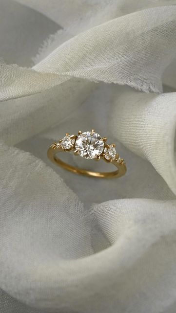 Laurie Fleming on Instagram: "The sun, moon & stars alight upon your finger🌅 Our Wild Iris Ring with her trio of brilliant diamond blooms, paired with the Diamond Aisling Circlet Band—a truly dazzling engagement & wedding ring set." Laurie Fleming, Iris Ring, Engagement Wedding Ring Set, Wild Iris, Engagement Wedding Ring Sets, Sun Moon Stars, Engagement Wedding Ring, Wedding Ring Set, Moon Stars