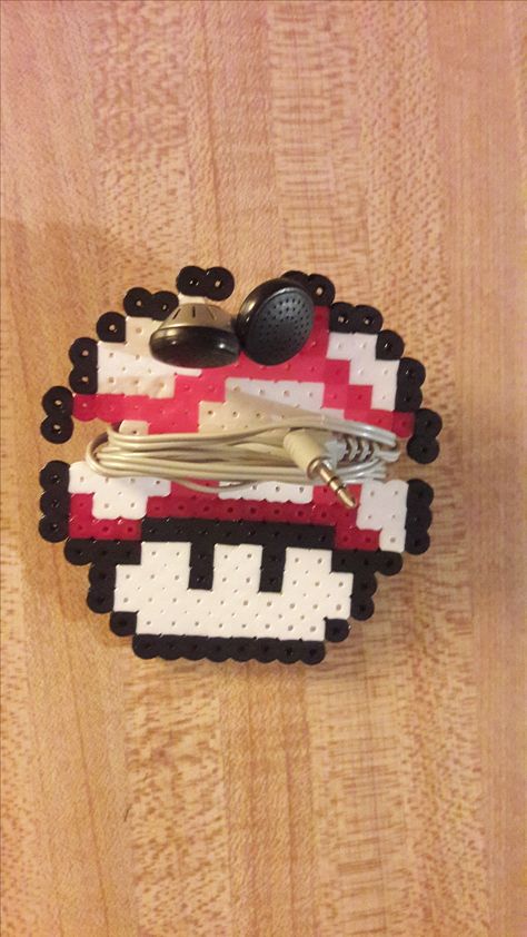 Mega Mushroom ear bud holder - Perler Bead Super Mario World www.etsy.com/shop/PerlerBeadArmory Peeler Bead Earring Holder, Perler Bead Headphone Holder, Perler Bead Earbud Holder, Game Controller Perler Beads, Kids Gift Exchange, 3d Mario Perler Beads, 3d Yoshi Perler Beads, Hama Beads 3d, Earbud Holder