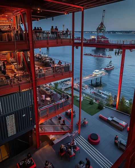 bar industrial repurposing the docks with bars, restaurants, breweries, and other amenities to active the waterfront with life. industrial spaces will eventually become overtaken by city grown and absorbed into the urban fabric. #imagine #midjourneyarchitect #midjourney #artificialintelligence #artificialarchitecture #artificialsketchbook #designboom #architecture #design #generativedesign #urban #city #seattle #industrial #bardesign #restaurantdesign Waterfront Design, River Bar, Bar Industrial, Seattle Waterfront, Transformation Project, Industrial Building, Industrial Architecture, Industrial Space, Generative Design