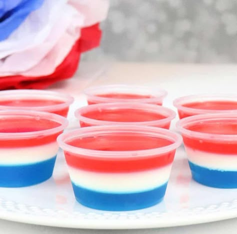 Get the recipe for red white and blue layered jello shot. These shots are the perfect summer drink for your patriotic party. Coconut Jello, White Jello, Blue Jello Shots, Red White And Two, Jello Pudding Shots, Yummy Summer Cocktails, Layered Jello, Fourth Of July Recipes, Blue Jello