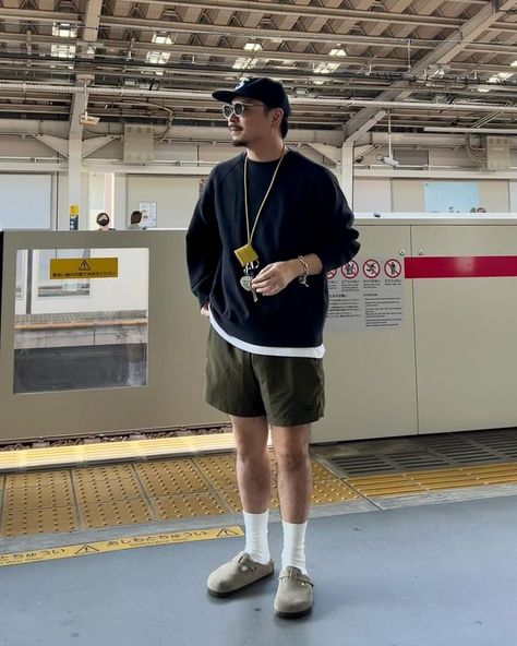 man wearing sweatshirt, shorts, and birkenstock clogs Birkenstock Clogs Outfit Men, Mens Birkenstocks Outfit, Birkenstock Boston Outfit Men, Birkenstock Outfit Men, Potato Shoes, Boston Clogs Outfit, Clog Outfits, Birkenstock Clogs Outfit, Birkenstock Boston Outfit