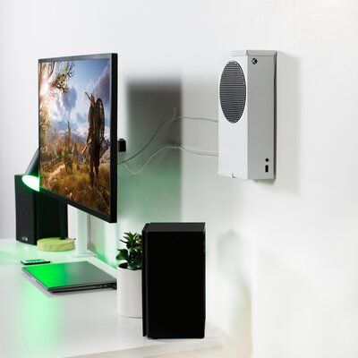 Customize Your Gaming Setup With Wall Mount For Xbox Series S (Mount-Xssu1) From Vivo! Made Of High-Grade Steel For Excellent Support, This Versatile Mount Will Hold Your Xbox S In A Safe, Convenient Location For All Your Gaming Adventures. The Bracket Design Supports Both Horizontal And Vertical Orientation, And Mounting Hardware Is Included For Wood Stud, Drywall, And Under-Desk Installation. The Open Design Keeps Your Xbox S From Overheating, And A Security Lock Provides Maximum Protection. | Xbox Setup Bedroom, Xbox Wall Mount, Xbox Series S Setup, Xbox Gaming Setup, Xbox Setup, Victorian Bohemian Decor, Collection Room, Simple Floor Plans, Black Feature Wall