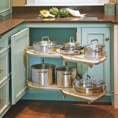 Optimize corner and base cabinets with pull-out or rolling shelves | 7 Kitchen-Storage Hacks To Double Your Usable Space Cabinet For Pots And Pans, Kitchen Corner Cabinet, Corner Cabinets, Kitchen Storage Hacks, Kitchen Cupboard Designs, Kitchen Corner, Kitchen Cabinet Organization, Corner Cabinet, Kitchen Redo