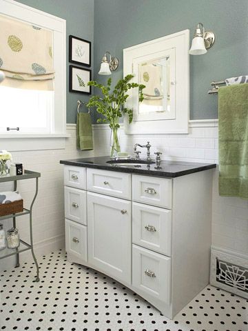 Love the wall colour!  Small yet bright bathroom.  The white subway tile and timeless black granite countertop allow for endless colour accents...fuschia, lagoon blue, chartreuse, red.... Check out BHG for more ideas! Black And White Bathroom Cabinets, Black Granite Countertops Bathroom, Queenslander Homes, Makeover Kamar Mandi, Black And White Tile, Craftsman Bathroom, Black Granite Countertops, Bright Bathroom, Bathroom Remodels