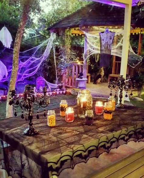 Gazebo Halloween Decor. Halloween Graveyard. Halloween Party Table Design. Outdoor Halloween entertaining space #night #outdoorspace #outdoordecor #halloween #halloweenparty #graveyard #candy #candles #blacklight #spooky #halloweendecor #firepit #fallfoliage #outdoordecor #gazebo Halloween Gazebo Decorations, Halloween Gazebo, Halloween Backyard Party, Halloween Party Backyard, Halloween Bbq, Halloween Date Ideas, Halloween Timeline, Halloween Party Outdoor, Halloween Exterior