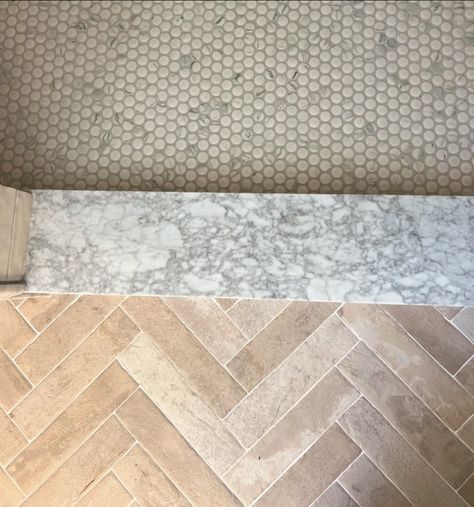 This is one of our favorite transitions! We love the combination of natural herringbone brick leading to a marble threshold and penny tile. Fun fact: using a small patterned tile for a shower floor is essential as it helps maintain the necessary slope for proper drainage. Annapolis interior design. Annapolis real estate. Bathroom remodel. #intudesign Tile Shower Floors, Penny Tile Shower Floor, Herringbone Brick Floor, Marble Threshold, Herringbone Brick, Brick Floor, Shower Floors, Patterned Tile, Penny Tile