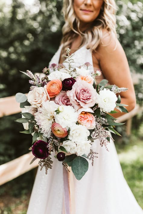 Blush, peach, and burgundy bridal bouquet by Feisty Flowers. Photography by Hello Rose Photography (hellorosephotography.com)  #bridalbouquet #milwaukeeflorist #texturalbouquet #ranunculus #summerwedding #milwaukeewedding Burgundy Peach Pink Wedding Flowers, Bride Bouquets May Wedding, Burgundy Ranunculus Bouquet, Burgundy Peach Cream Wedding, Bridal Bouquet September Wedding, Burgundy Peach Ivory Wedding, April Bridal Bouquet, Neutral Bouquet With Pop Of Color, Bridal Bouquet November