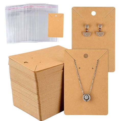 PRICES MAY VARY. Value Bundle- 150 pcs brown Earring display cards and 150 pcs self-adhesive bags, great value and long lasting. Perfect for storing or displaying earrings necklace or other jewelries Professional Made - Necklace cards are made of blank kraft paper, environmental,sturdy and durable.Jewels and sparkles stand out against the kraft background. The bags are made from opp plastics, transparent and clean Blank Space for Your DIY- Plenty of space to write or print your own logo, price o Cajas Silhouette Cameo, Diy Necklace Holder, Earring Card Display, Necklace Jewelry Display, Kraft Paper Tags, Homemade Necklaces, Jewelry Display Cards, Packaging Diy, Diy Jewelry Display