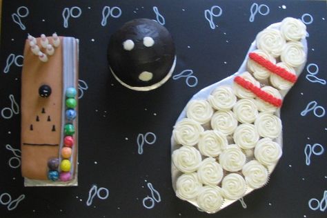 For my son's birthday at a bowling alley.  Bowling Pin is cupcakes with buttercream frosting.  For bowling ball I used the sports ball pan and buttercream icing.  The bowling alley is fondant (first use for me) with bowling pin candles.  Board is black foam core with white paint pen drawings. Bowling Alley Party, Cupcakes With Buttercream Frosting, Bowling Cake, Cupcakes With Buttercream, Buttercream Frosting For Cupcakes, Bowling Birthday Party, Bowling Party, Kids Party Food, Bowling Alley