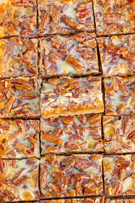 These Pecan Magic Pumpkin Bars are irresistible for a fall treat. Layers of cookie bottom, pumpkin, butterscotch, toffee and more make for a great fall treat. Pecan Pumpkin Magic Bars, Pecan Pumpkin Bars, Pumpkin Pecan Pie Bars, Fall Bar Cookies, Fall Dessert Bars, Pumpkin Magic Bars, Chocolate Pumpkin Desserts, Fall Dessert Bar, Butterscotch Toffee