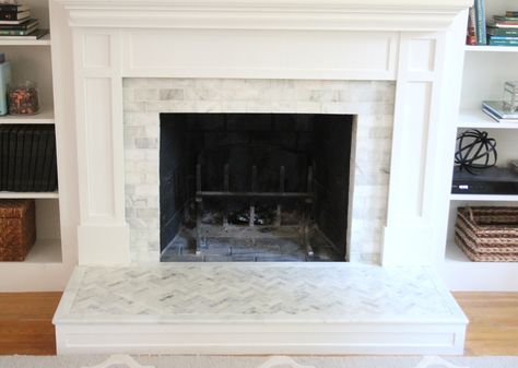 We ripped apart our fireplace and gave it a whole new look. Here's the scoop on tiling over the brick and totally changing the look and feel of our house. Subway Tile Fireplace, Tile Around Fireplace, Hearth Tiles, Fireplace Redo, Brick Hearth, Fireplace Mantles, Tv Ideas, Fake Fireplace, Flip Ideas