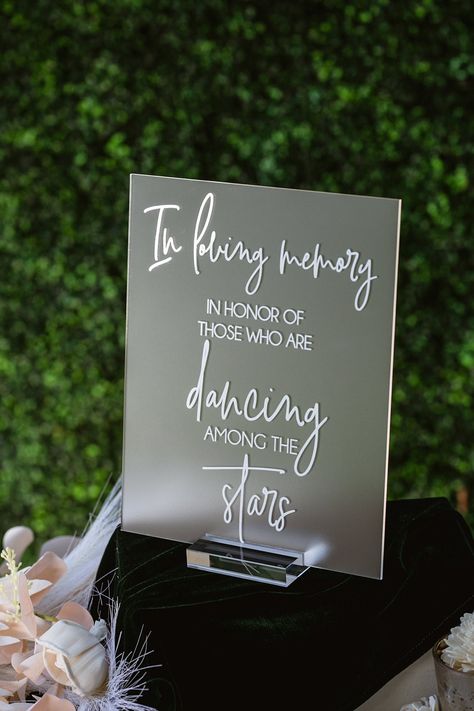 Click on the following link to browse HUNDREDS more designs in our shop!! https://pinkposiesandpearls.etsy.com/  In Loving Memory In Honor Of Those Who Are Dancing In Heaven Modern Clear Glass Look Acrylic Wedding Memorial Sign, SIG-DH5                                          | Welcome to Pink Posies and Pearls Wedding and Gift Boutique | | THE PRODUCT | *We love the clean lines of this clear acrylic In Loving Memory sign. We can print these signs in ANY color! Choose a color from the swatches image or let us know your custom color you would like printed (all but metallics). We offer clear stands. *.    This acrylic is a display material that is strong, moisture resistant & visually clearer than glass, not to mention shatterproof! *.    Need this in different wording? No problem! Put your Take A Glass Wedding Sign, In Loving Memory Cricut Ideas, Diy In Loving Memory Ideas, Glasses For Wedding Reception, Dancing In Heaven Wedding Sign, In Honor Of Those In Heaven Wedding, Under The Stars Wedding Decorations, Memorial Signs For Weddings, Wedding In Memory Sign