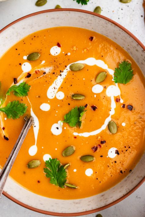 Pumpkin and sweet potato soup served in a bowl topped with a drizzle of cream, cilantro and pumpkin seeds. Pumpkin Sweet Potato Soup, Chilli Soup, Healthy Vegetarian Breakfast, Carrot And Lentil Soup, Sweet Potato Soup Recipes, Red Pepper Soup, Pumpkin Soup Recipe, Pasta Side Dishes, Tomato Soup Recipes