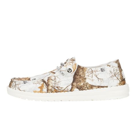 HEYDUDE | Women's Casual | Wendy Realtree Edge® Colors - White/camo | Size 5 - Introducing the ultimate blend of rugged and refined. These kicks are ready to tackle the great outdoors, but won't shy away from a night on the town. Easy-on system, flexible outsole and the classic Realtree edge pattern. Get ready to be effortlessly cool, and comfortable whether you're stalking your prey or stalking that new coffee shop. Shoe Specs: Flex & Fold Technology Ultralight outsole Canvas Realtree Edge® pattern top Realtree Edge® pattern footbed Easy-On System with two-toned sport lace Textile-lined, removable insole Relaxed Fit: Ample roominess allows for laid-back, easygoing feel Women's Casual Shoes, Wendy Realtree Edge® Colors - White/Camo, Hey Dude, HEYDUDE | Women's Casual | Wendy Realtree Edge® Country Hey Dudes, Hey Dude Shoes Women, Country Summer Outfits, Shop Shoe, School Uniform Shoes, Country Shoes, Country Nails, School Uniform Kids, Western Clothing