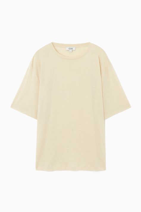 This T-shirt evokes a nonchalant ease, owing to the laid-back silhouette and floaty TENCEL™ Lyocell jersey, which was chosen for its super soft hand feel and fluid drape. It's designed with dropped shoulders and elbow-length sleeves that enhance the relaxed shape and offered in a dusty-white hue that will complement everything you style it with.- Relaxed fit, 160gsm- Crew neck, dropped shoulders, elbow-length sleeves- TENCEL™ is a trademark of Lenzing AG. TENCEL™ Lyocell is made from renewable wood sources, using a process that recycles 99% of all chemicals and water100% TENCEL™ Lyocell / Machine washBack length of size S is 25.19" / Model wears a size S Denim Suit, New Pant, Window Shopping, Tshirt Skirt, Vest Shirt, Cardigan Top, Knitwear Cardigan, Pant Shirt, Elbow Length Sleeve