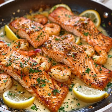 🍤 Delight in the flavors of Garlic Lemon Butter Salmon and Shrimp! 🍋✨ #GarlicLemonButter #SeafoodDelight Garlic Lemon Butter Salmon and Shrimp Ingredients: Salmon fillets (2, about 6 oz each) Shrimp, peeled and deveined (1/2 lb) Butter (3 tbsp) Garlic, minced (4 cloves) Lemon juice (2 tbsp) Lemon zest (1 tsp) Parsley, chopped (for garnish) Salt and pepper (to taste) Instructions: Melt butter in a skillet over medium heat. Add garlic and sauté until fragrant. Add salmon fillets and cook fo... Buttery Salmon, Lemon Butter Salmon, Cooked Salmon, Salmon And Shrimp, Butter Salmon, Table Manners, Tastemade Recipes, Baked Salmon Recipes, Healthy Food Dishes