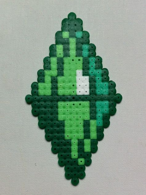 The Sims - Plumbob. (or Green Diamond) But yes, apparently its official name is a Plumbob. Yes, it is weird. Created from hama beads Perler Bead Diamond, Green Perler Bead Ideas, Sims Cross Stitch, Weird Perler Bead Patterns, Sims Plumbob, Melty Bead Designs, Easy Perler Bead Patterns, Perler Creations, 3d Perler Bead