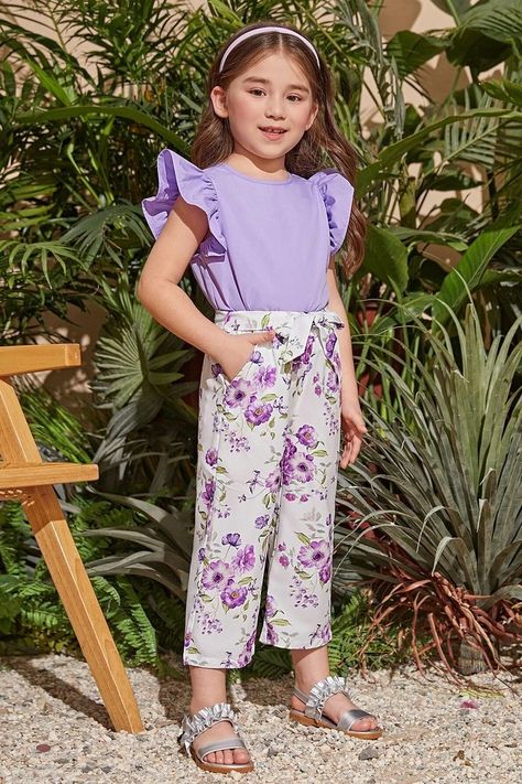 This top and pant set is cool and stylish. Butterfly sleeve, crew neck, floral print. #girls #top #pant #ruffle Two Piece Outfits Pants, Kids Winter Outfits, Dolly Dress, Ruffle Trim Top, Baby Frock, Floral Print Pants, Dress Design Patterns, Girls Top, Butterfly Sleeve