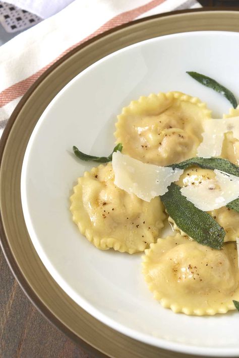 Pumpkin Ricotta Ravioli comes with sage butter sauce and made with homemade pasta. The ravioli are filled with a creamy mix of pumpkin and ricotta along which make a perfectly comforting and seasonal Italian dinner. #pumpkinravioli #ricotta #homemaderavioli #sagebutter Ricotta Ravioli Recipe, Pumpkin Ricotta, Sage Butter Sauce, Pumpkin Ravioli, Ricotta Ravioli, Pumpkin Dishes, Recipe Pumpkin, Homemade Ravioli, Sage Butter