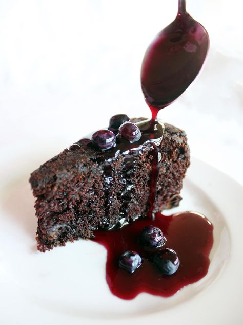 This chocolate cake has blueberries in the batter and is served with an easy-to-make blueberry sauce. Blueberry Filling Recipe, Cake With Blueberry Filling, Blueberry Chocolate Cake, Blueberry Filling, Blueberry Cake Recipes, Blueberry Chocolate, Chocolate Sheet Cake, Blueberry Sauce, Berry Cake