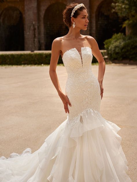 Walk down the aisle in effortless elegance and luxury. Our Moonlight Couture H1531 wedding dress has all the glamour and sophistication you need to make your special day perfect. This sleek mermaid wedding dress features a strapless neckline with a plunge and a fluffy cascading tulle skirt that will flow gracefully as you walk, leaving everyone in awe. Check out the link for more and get the perfect wedding look for your special day. #straplessweddingdress #bridallook #weddingdressideas Moonlight Couture, Moonlight Bridal, Country Bride, Couture Bridal Gowns, Ivory Gown, Sparkle Skirt, Bridal Gowns Mermaid, Geometric Lace, Wedding Gowns Mermaid