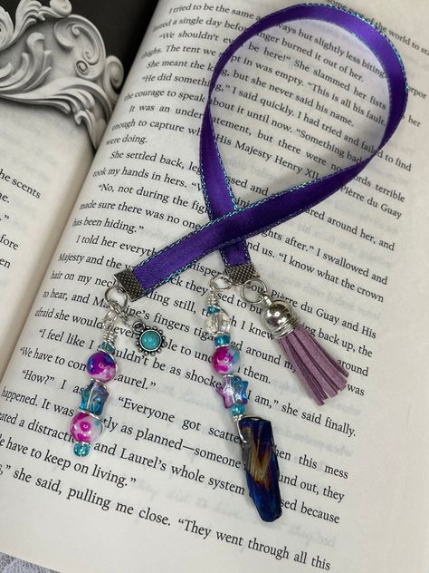 You will get one Bookmarks as pictured.The ribbon is 11.5 inches long not including the charms. -This is a Handmade bookmark out of ribbon and charms with accessories. They are adorable and would make the perfect gift for any BOOK LOVER in your life, or the perfect little treat for yourself ;) -I do not accept returns or exchanges but please contact me if there was an issue with your order or item.I will do my best to help or fix the issue. -Thank you again for your business. We Appreciate you j Book Hacks, Journal Charms, Purple Bookmark, Bookmark Ribbon, Vintage Bookmarks, Charm Bookmark, Origami For Beginners, Bookmark Handmade, Paper Bookmarks