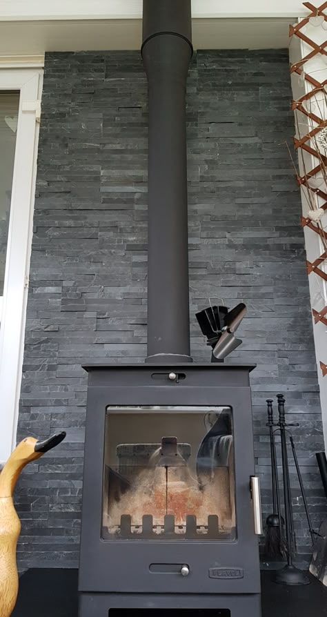 Black Wood Stove Hearth, Black Wood Stove Surround, Tiles Behind Log Burner Corner, Tile Behind Log Burner, Indoor Wood Burner, Log Burner Tiled Back, Wood Burning Stove Fireplace Surround, Tile Wall Behind Wood Stove, Wood Stove Accent Wall