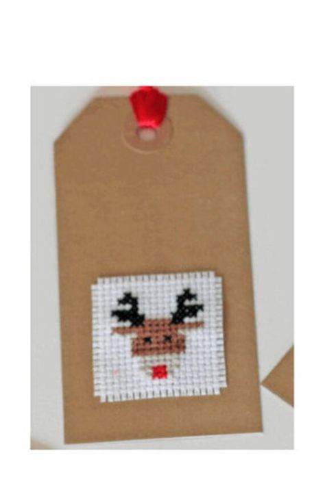 Fantastic simple cross stitch project - great for children and beginners, and a fun quick project for more experienced cross stitchers in the run up to Christmas! Would also make an excellent stocking filler. Kit includes materials and patterns for four children's themed Christmas gift tags. The kit contains everything you need to complete: - Pre cut and sorted DMC floss - 14 count white AIDA - Cross stitch needle - Cross stitch chart and key - 4 blank craft tags - cord / twine - beginner's guid Simple Christmas Cross Stitch, Cross Stitch Christmas Gifts, Christmas Cross Stitch Patterns Free, Cross Stitch Christmas Cards, Cross Stitch Necklace, Christmas Gift Tags Diy, Cross Christmas Tree, Xmas Tags, Tiny Cross Stitch