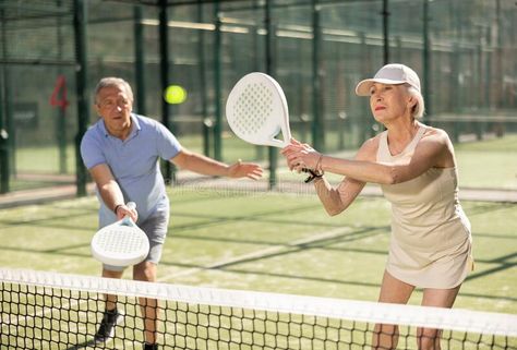 Determined sporty older husband and wife doing his best playing padel in court royalty free stock photo Couples Play, Corporate Videos, Old Couples, Tennis Clubs, Old People, Husband Wife, Retirement Planning, Tennis Players, Fitness Goals