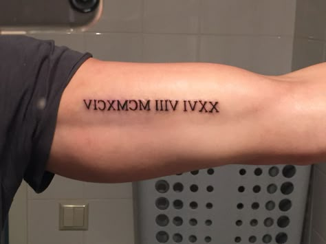 Roman Numeral Tattoo Men Bicep, Roman Number Tattoo Men, Bicep Roman Numeral Tattoo, Roman Numeral Tattoo Bicep, Mens Roman Numeral Tattoo, Tattoo Ideas Kids, Roman Number Tattoo, 1987 Tattoo, Roman Numeral Tattoo Men