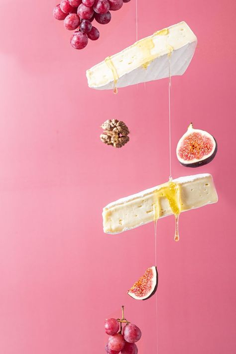 Flying cheese. Brie cheese with honey on a pink background Cheese With Honey, Cheese Brie, Brie Cheese, Brie, Food Styling, Pink Background, Food Inspiration, Honey, Cheese