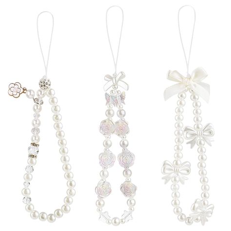 PRICES MAY VARY. 【3 Pack】3 pieces white pearl butterfly bow flower phone charms will be delivered to you under this package. 【Premium Material】This phone charms strap is made of faux pearls, acrylic beads, polymer clay and strong nylon rope, which is durable with a long service life. 【Anti-slipping】The flower phone charm strap is sturdy and durable, easy to carry, can be hung on your wrist to prevent your phone from falling or losing, its size is suitable for most people. 【Aesthetic Design】These Phone Charms Aesthetic Simple, Simple Phone Charms, Pearl Phone Strap, Phone Bracelet Ideas, Pearl Crafts Ideas, Phone Strap Aesthetic, White Phone Strap, White Phone Charm, Diy Phone Charms