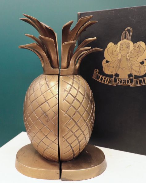 Always a favorite, pineapples symbolize everything from hospitality and wealth, to Hawaii, and even fertility. These vintage brass pineapple bookends bring all that to mind, and add a touch of fun to a bookshelf! https://thatsmyjammfinds.etsy.com/listing/1689606199 #pineapple #fertility #infertility #vintagegifts #vintagebooks Brass Pineapple, Google Lens, Vintage Books, Vintage Gifts, Fertility, Vintage Brass, Bookends, Beautiful Homes, Pineapple