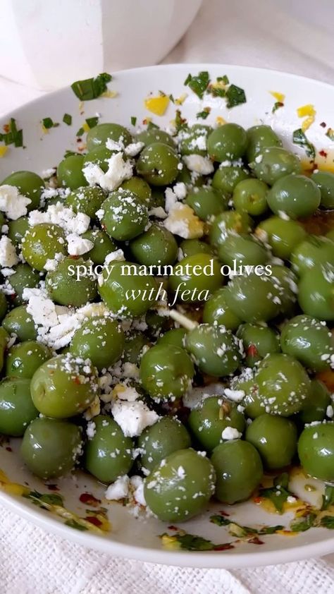 spicy marinated olives & feta is the easiest appetizer you can make for when hosting or to keep in your fridge to snack on! these are a must & are so. damn. delish 🫒 find the recipe below, enjoy xx spicy marinated olives with feta Ingredients 1 jar of olives of choice (I love Castelvetrano) 1 garlic clove, grated 1/2 lemon, zested 1/2 cup olive oil 1/2 tsp Aleppo pepper 1/2 tsp chili flakes 2 tbsp parsley, chopped 1/4 tsp fennel 1/3 cup feta, crumbled #olives #feta #marinatedolive Spicy Marinated Olives, Castelvetrano Olives Recipe, Jar Of Olives, Castelvetrano Olives, Aleppo Pepper, Holiday Appetizers Recipes, Marinated Olives, Olive Recipes, Hyper Fixation