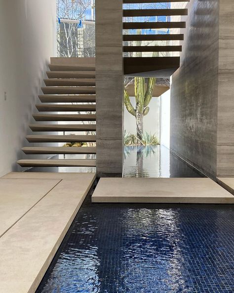 Mimi London Inc. on Instagram: “Stairway to heaven. A dramatic staircase floats above serene, reflective pools of water— a central idea of the home—tying The Sea of…” Stairs Landscape Design, Dramatic Staircase, U Shaped Stairs, Sea Villa, Staircase Outdoor, Modern Foyer, Indoor Water Features, Compound Wall, Central Idea