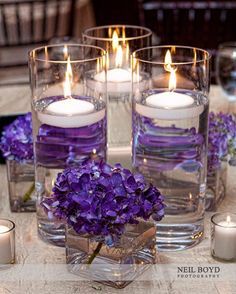 Centerpiece Wedding Centerpieces Hydrangea, Purple Floating Candles, Wedding Reception Centerpieces Candles, Wedding Reception Candles, Candles Reception, Purple Reception, Purple Centerpieces, Flowers And Candles, Floating Candle Centerpieces