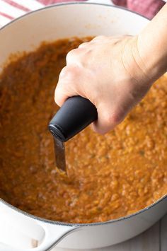 Mashing Refried Beans (Instant Pot or Stovetop!) #ASpicyPerspective #beans #mexican #canned #dried #instantpot Rosarita Refried Beans Recipe, Authentic Refried Beans Mexican Style, Stovetop Refried Beans, Refried Beans Recipe Canned, Authentic Refried Beans Mexican Style Instant Pot, Easy Refried Beans Recipe, Refried Beans Instant Pot, Canned Pinto Beans Into Refried Beans, Best Refried Beans Recipe