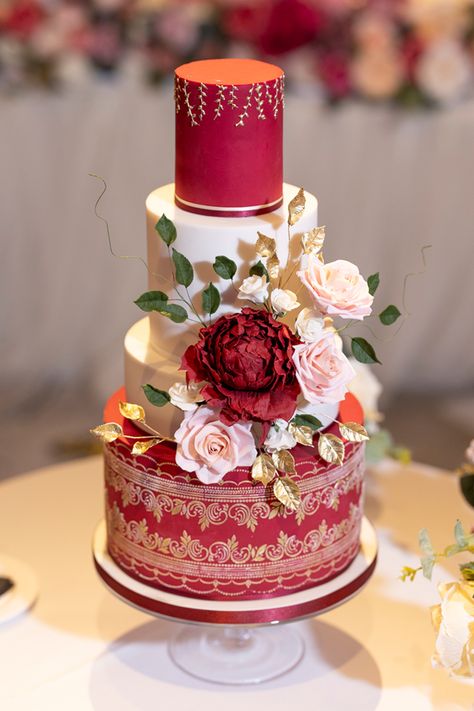 A Burgandy, gold and white beauty at The Langham in London for this Hindu asian wedding celebration. I decorated the cake with sugar flowers, hand piped gold vines and a mehndi pattern on the bottom tier. The style was bold, bright and opulent. The cake took center stage on the dancefloor at this iconic hotel. Simple Hindu Wedding, Mehndi Patterns, Hindu Wedding, Wedding Celebration, Sugar Flowers, Asian Wedding, Red Wedding, Center Stage, Cake Art