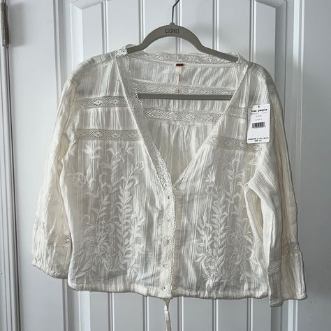 Beautiful Free People Ivory Embroidered Blouse Deep V Neckline Trimmed In Delicate Crochet Trim Floral Embroidery Snap Front With Drawstring Waist 3/4 Elastic Sleeves 200% Cotton Size L Measurements Pit To Pit- 24” Length Underarm To Hem- 10” Length Shoulder To Hem- 20” New With Tags Msrp $68 Embroidered Top Outfit, Crochet Bell Sleeve, Ruffle T Shirt, Delicate Crochet, Elastic Sleeves, Plaid Pullover, Patchwork Top, Boho Lace, Bell Sleeve Blouse