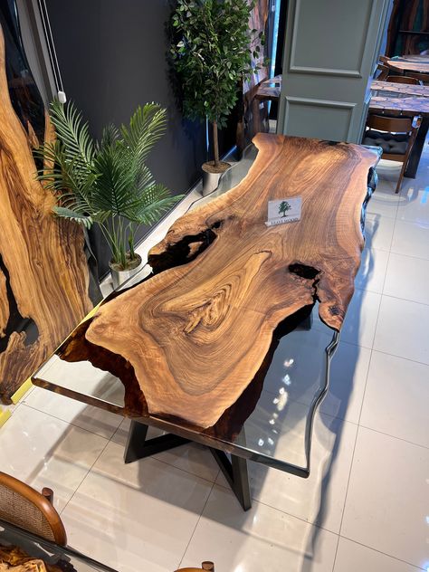 IN STOCK size 114" x width 43" Single body magnificent walnut ONE PİECE SPECİAL WALNUT TREE The visual of the color tones of the tree is fascinating. My design in the visual is ready and I can send it to you, my valued customers, immediately. It is a type of tree that is not always found I can customize the table for you. You have different colour options. After deciding we can make the table. Dining Table for your living room or kitchen. Custom made wood dining table with clear epoxy like river pattern. Unique, special design with soft edges and handmade production just for you, your home and your kitchen. Due to natural shape of wood there may be cracks on it. We try to protect the natural shape of the product as much as possible. And you have various colour options. Assembly is required Tree Trunk Dining Table, Metal And Wood Bench, Epoxy Furniture, Luxurious Dining Room, Kitchen Custom, Luxury Dining Table, Table Epoxy, Walnut Tree, Wooden Dining Table