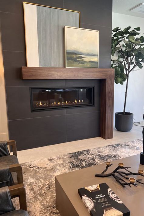 Enhance your living room with sleek floating shelves next to your fireplace. Discover how to create a stylish yet functional display that adds warmth and character to your home. Read the blog for all the ideas! #GoTinySpace #FloatingShelves Fireplace With Slate Tile, Modern Black And White Fireplace, Soft Black Fireplace, Contemporary Fireplace Insert, Black Large Format Tile Fireplace, Black Brick Tile Fireplace, Black Bedroom With Fireplace, Modern Mantels Fireplace, Flush Wall Fireplace Ideas