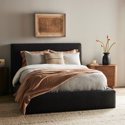 Modern, clean shaping meets inflated comfort with this padded, upholstered bed frame in a textural boucle-like pattern.Product Overview Available Colors: Lisbon Charcoal Lisbon Cream Dimensions: Queen: 73"W x 92.25"D x 48.5"H King: 89"W x 92.25"D x 48.5"H Materials: 81% Pl, 19% Pc, Solid Parawood Performance Fabric: Yes Distance Between Slats: 2.75" Weight: 188.38 lb Black And Oak Bedroom Ideas, Guest Room Ideas Black Bed Frame, Black Bed Bedroom Decor, Charcoal Bed Frame Bedroom Ideas, Modern Guest Room Ideas, Black Upholstered Bed Decor Ideas, Bedroom With Black Headboard, Dark Headboard Bedroom Decor, Black Bed Frame Decor