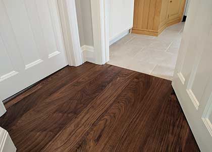 Floor Transition Ideas - Expert advice #CraftedForLife Tile To Dark Wood Transition, Hardwood To Vinyl Plank Transition, Floor Transition Ideas, Floor Transition, Transition Ideas, Oak Parquet Flooring, Lvp Flooring, Floor Sitting, Walnut Floors