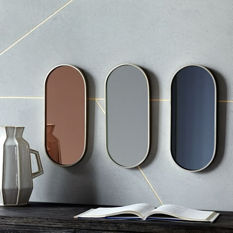 Pink, clear, smoked Pill Shaped mirrors by West Elm; $79 each. westelm.com Mod Mirrors, Shaped Mirrors, Oval Mirrors, Wall Mirror Decor, Mirror Interior Design, Big Wall Mirrors, Mirror Ceiling, Reuse Ideas, Tinted Mirror