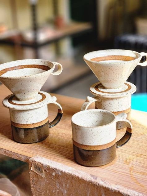 "This 14 ounce, modern, hand made mug and filter set is a great gift for anyone who enjoys a pour over coffee.  The satin white glaze offers a nice contrast against the dark colored stoneware.  A resist line across the center of the mug reveals the dark clay body, extending into a matte black glaze on the bottom half; there are also two resist lines on the pour over.    The Filter's one fingered handle allows for easy removal once the coffee is ready.  The foot ring will keep the filter in place while brewing.  Also available in Teal and Black on red clay. The funnel shape is ideal for conical paper filters.   Dishwasher and microwave safe (recommend hand wash) This purchase included one mug, and one ceramic pour over filter. Dimensions Mug: 4 x 3.25\" Filter: 3.5 x 5.5\"" Ceramic Coffee Pour Over Handmade, Stoneware Tea Set, Pottery Pour Over Coffee, Pour Over Coffee Pottery, Coffee Pour Over Ceramic, Pottery Pour Over, Ceramic Coffee Pour Over, Coffee Mug Ceramic, Ceramic Pour Over