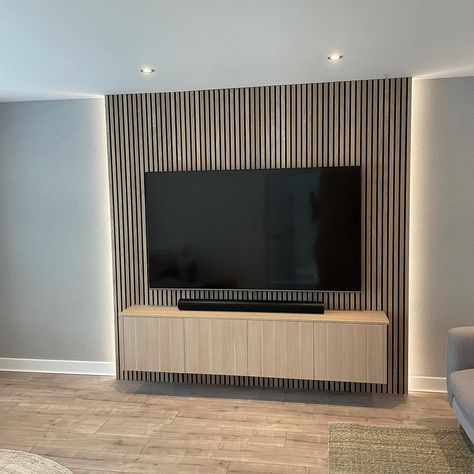 Media Accent Wall Ideas, Acoustic Panels Tv Wall Design, Vertical Wood Slat Wall Behind Tv, Wooden Panel Living Room, Tv Mounted On Wood Slat Wall, Wood Panelling Lounge, Wood Slats Living Room, Wood Panel Media Wall, Media Wall With Wood Panelling